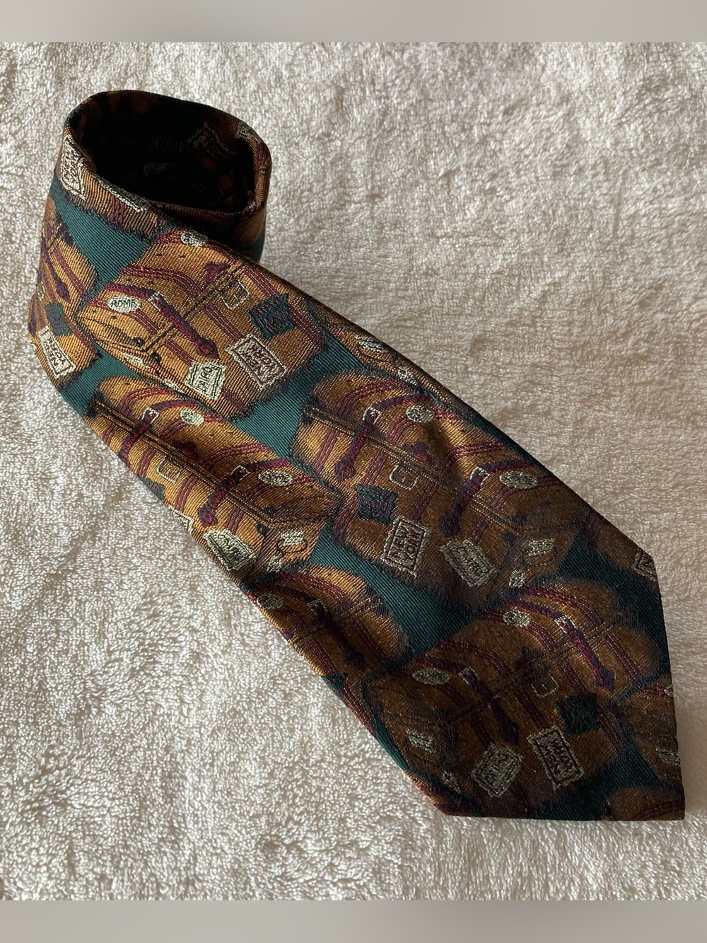 Vintage Polo Ralph Lauren green silk necktie with a woven travel luggage motif.